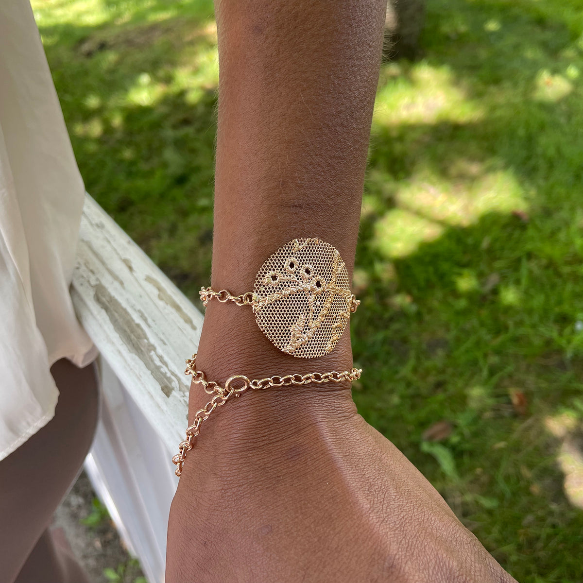 Charlie lace chain bracelet in rose gold with intricate details.