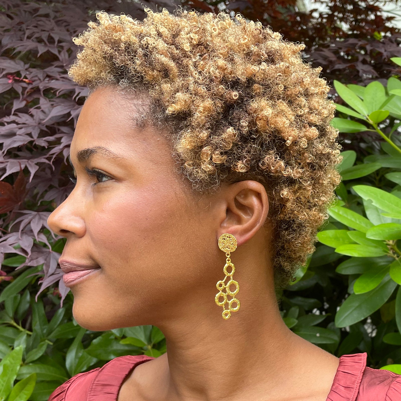 Dana circular lace dangle earrings in 24k gold.