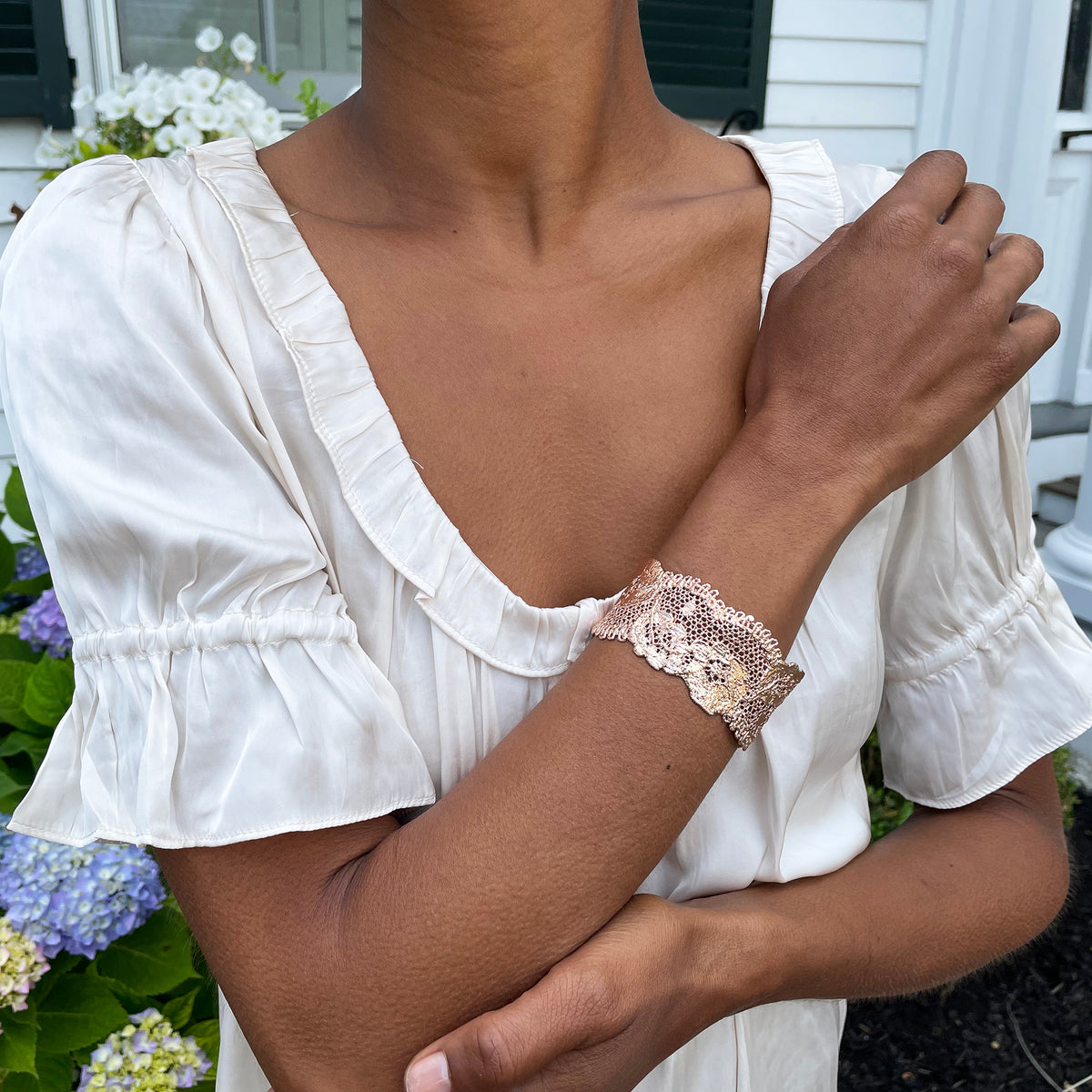 Donna lace cuff bracelet in rose gold on a model.