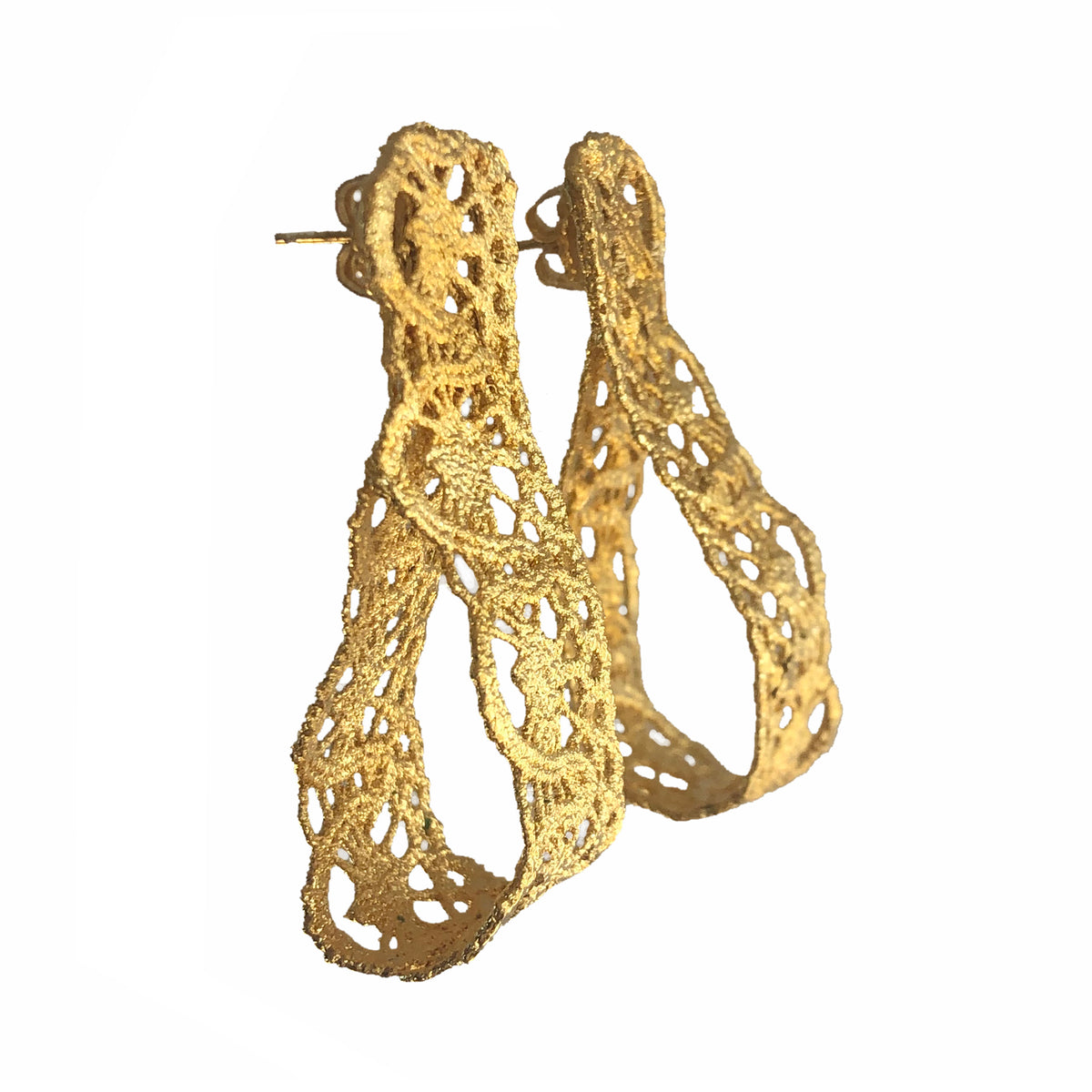 Favorite earrings made from French 1920s lace forming a loop and solidified in 24k gold.