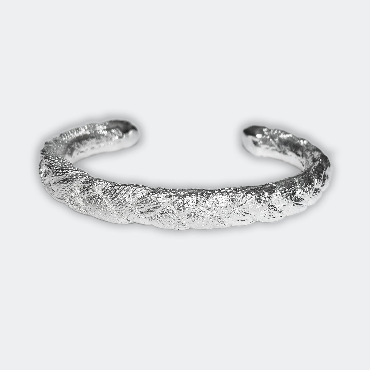 Braided open men&#39;s bangle bracelet in sterling silver.