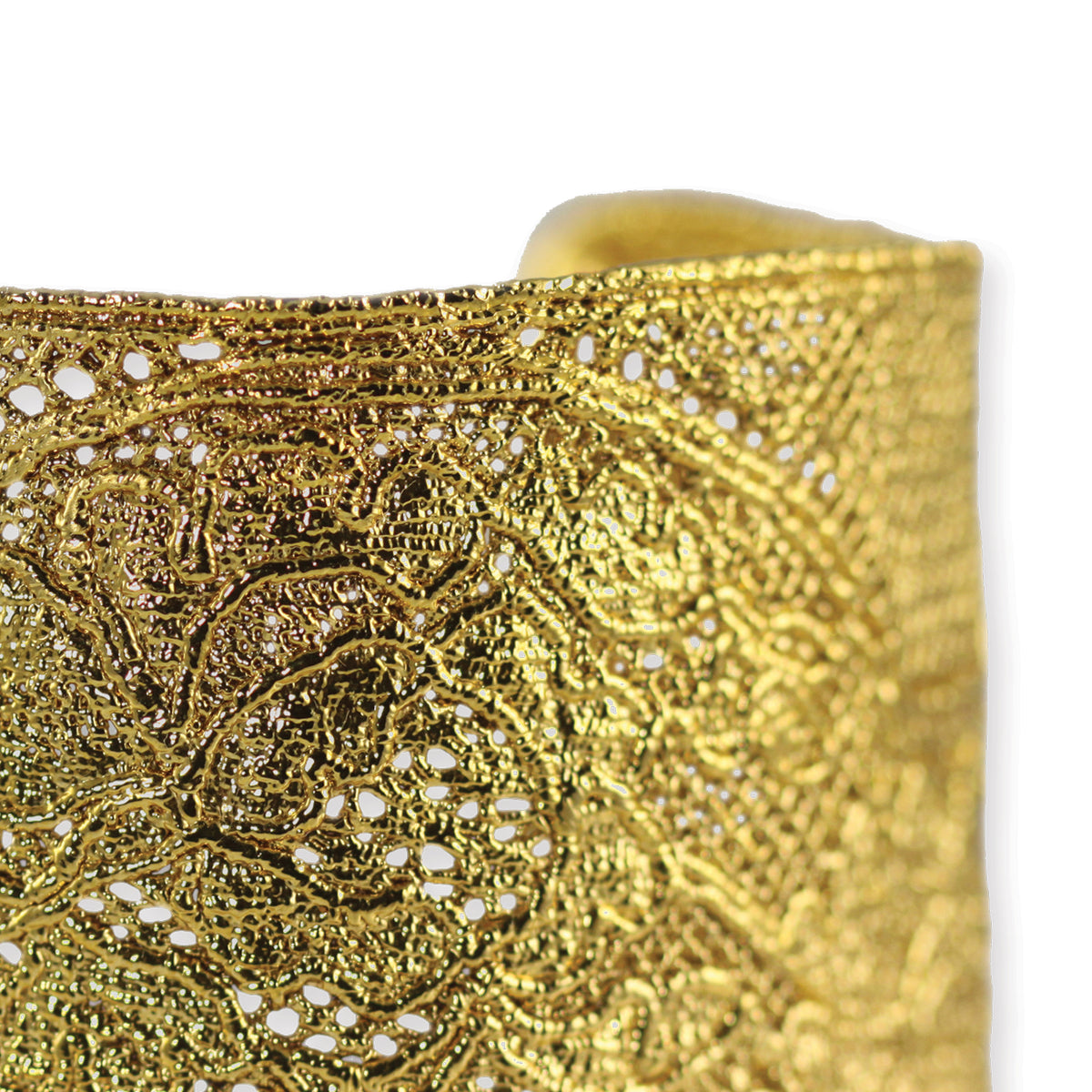 Detail from intricate lace cuff bracelet in 24k gold