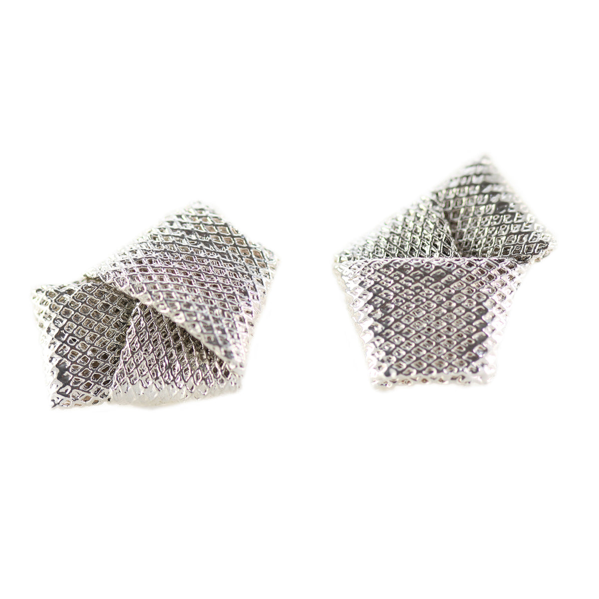 Cufflinks made from wedding dress tulle tied in a knot and dipped in sterling silver.