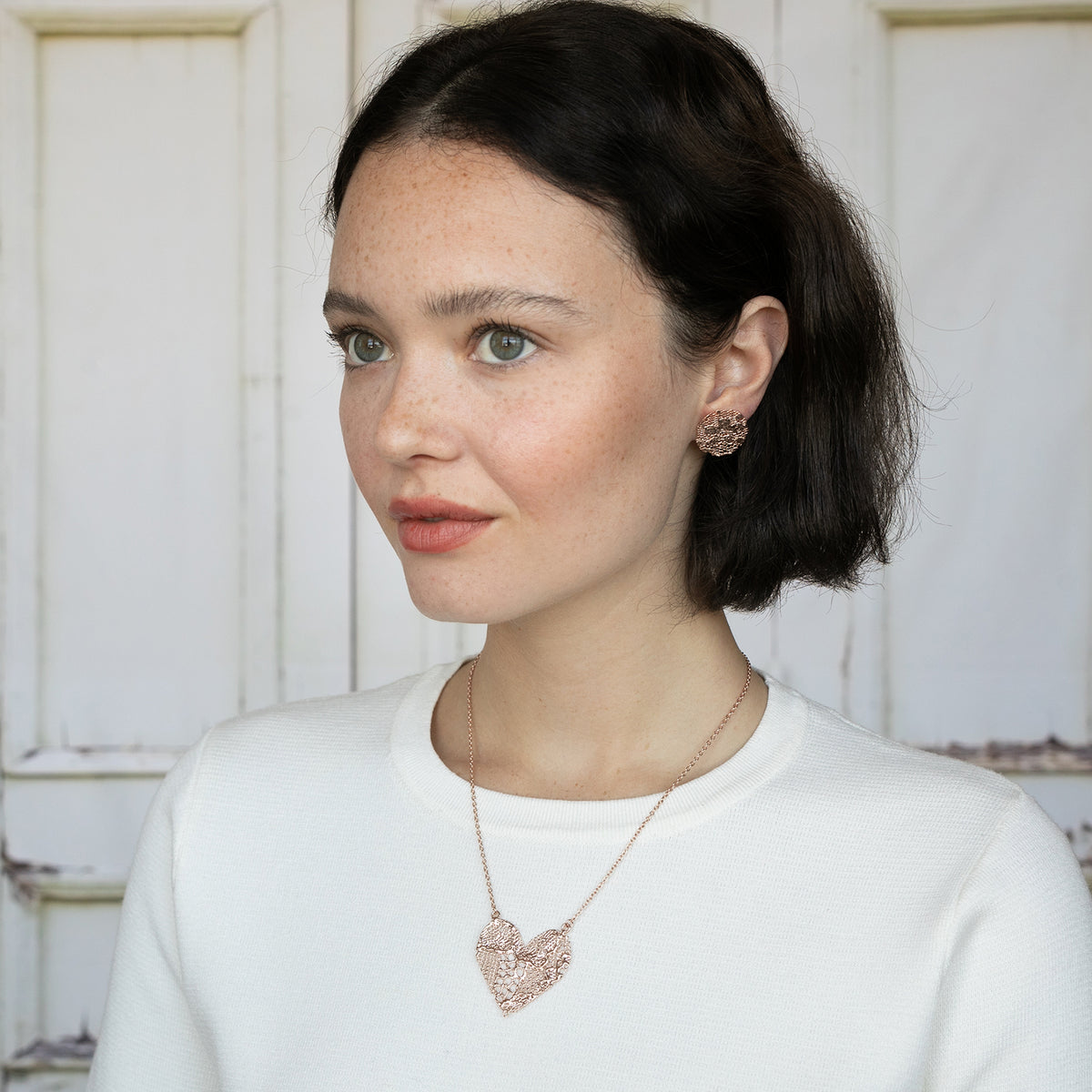 Model with Lace Heart Necklace. 13th anniversary gift with a WOW factor. Made from European Chantilly lace dipped in rose gold.