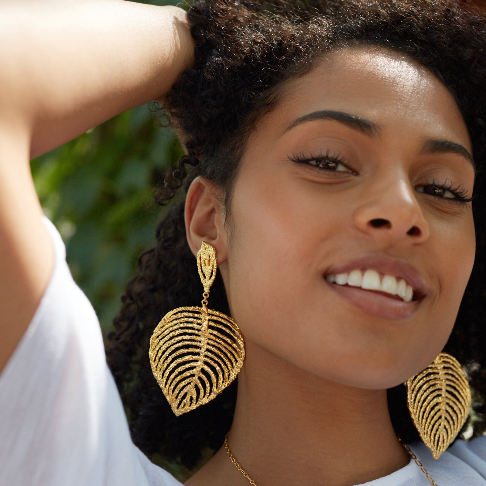 Large lace leaf earrings in 24k gold.