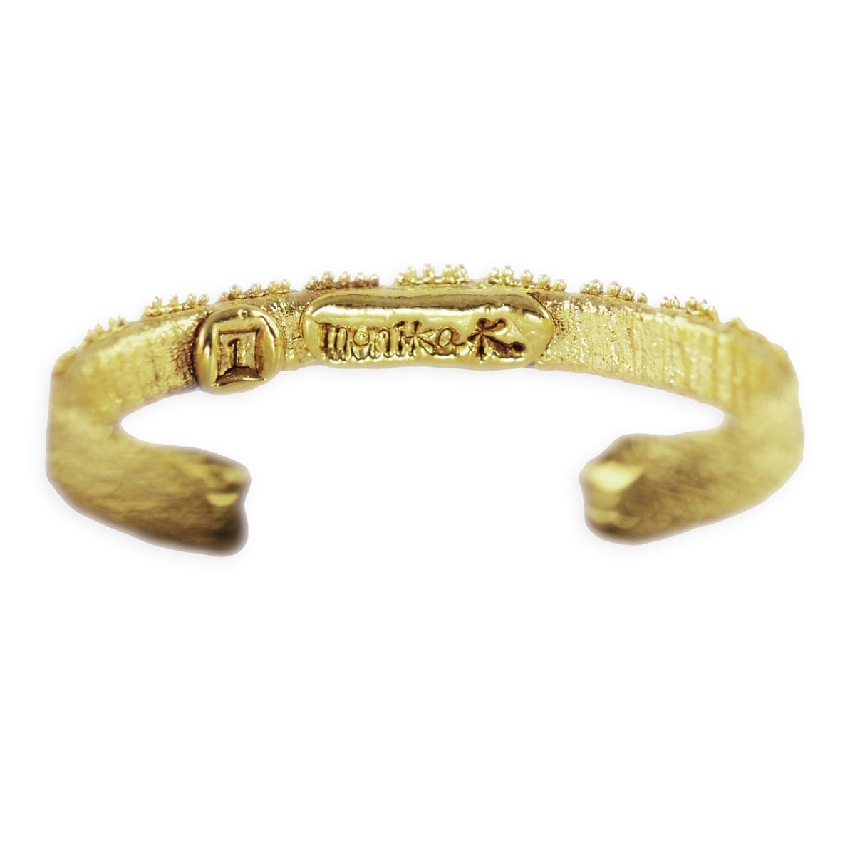 Lace bangle bracelet in 24k gold. Signed and numbered in the back.