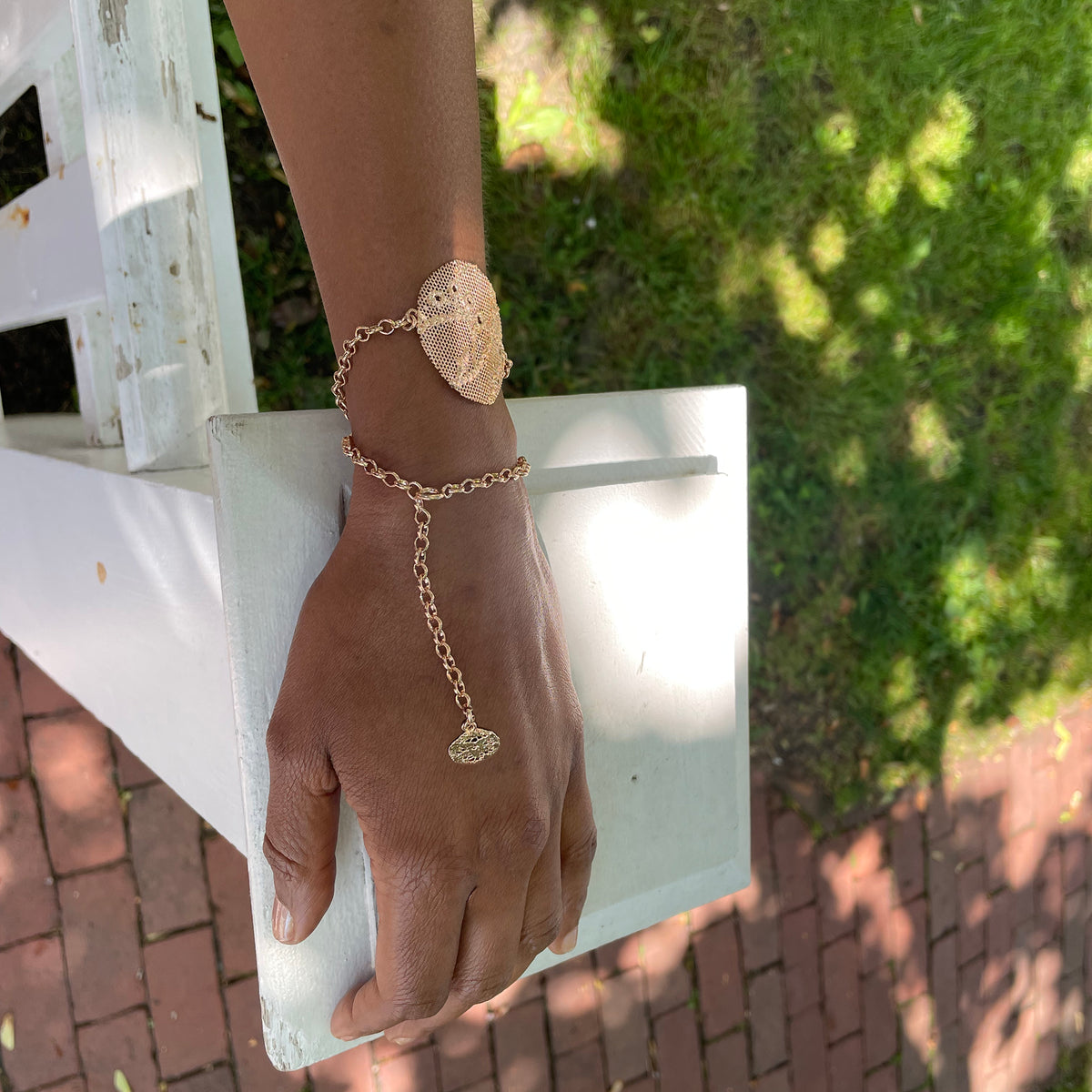 Charlie lace chain bracelet in rose gold with intricate details.