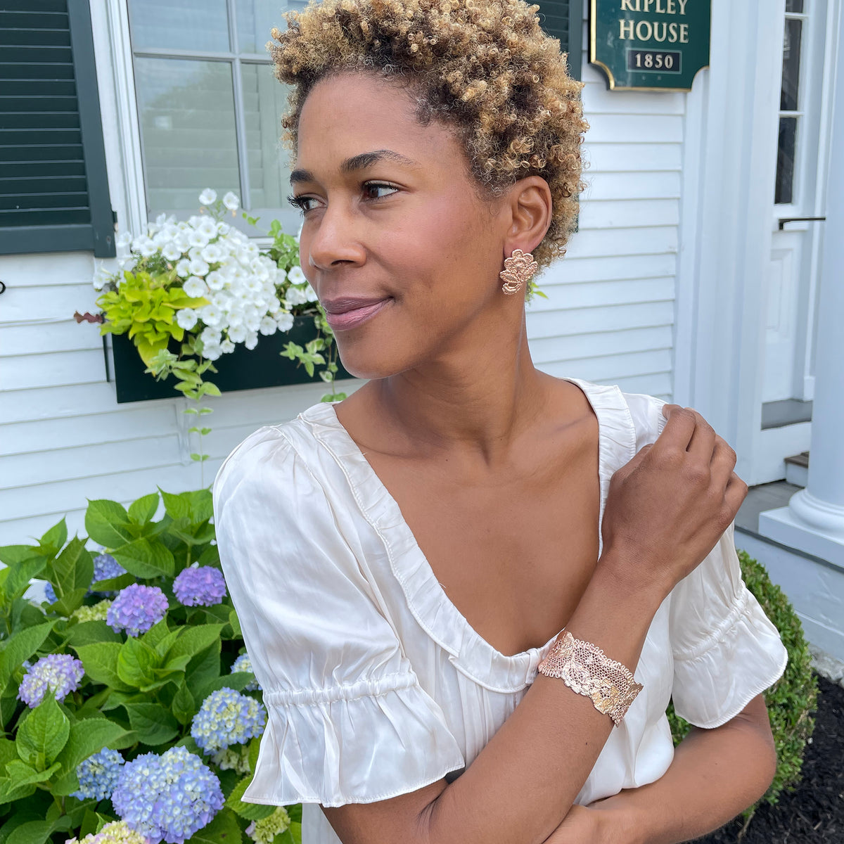 Donna lace cuff bracelet in rose gold on a model.