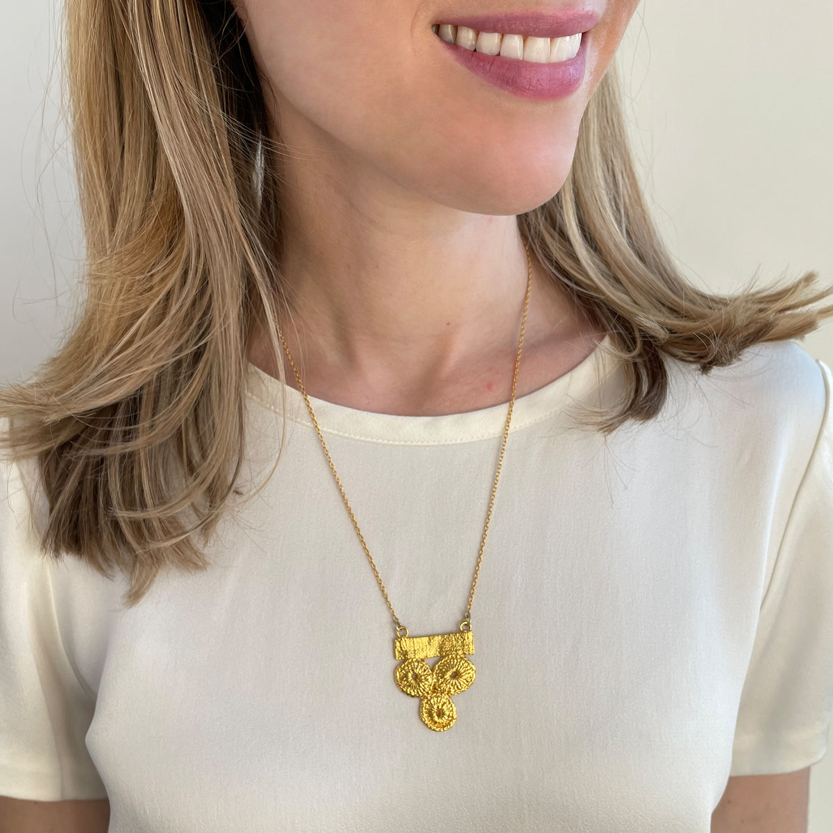 Rare 1910 American lace necklace dipped in 24k gold worn by a model.