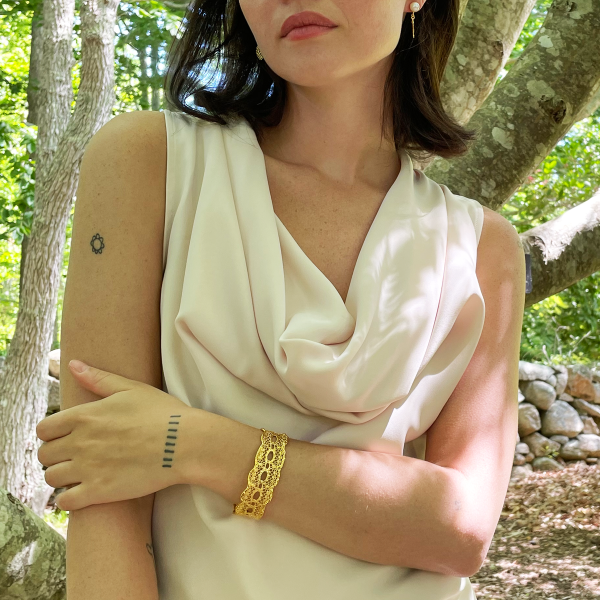 Zelia lace cuff bracelet in 24k gold ressembling a tattoo.