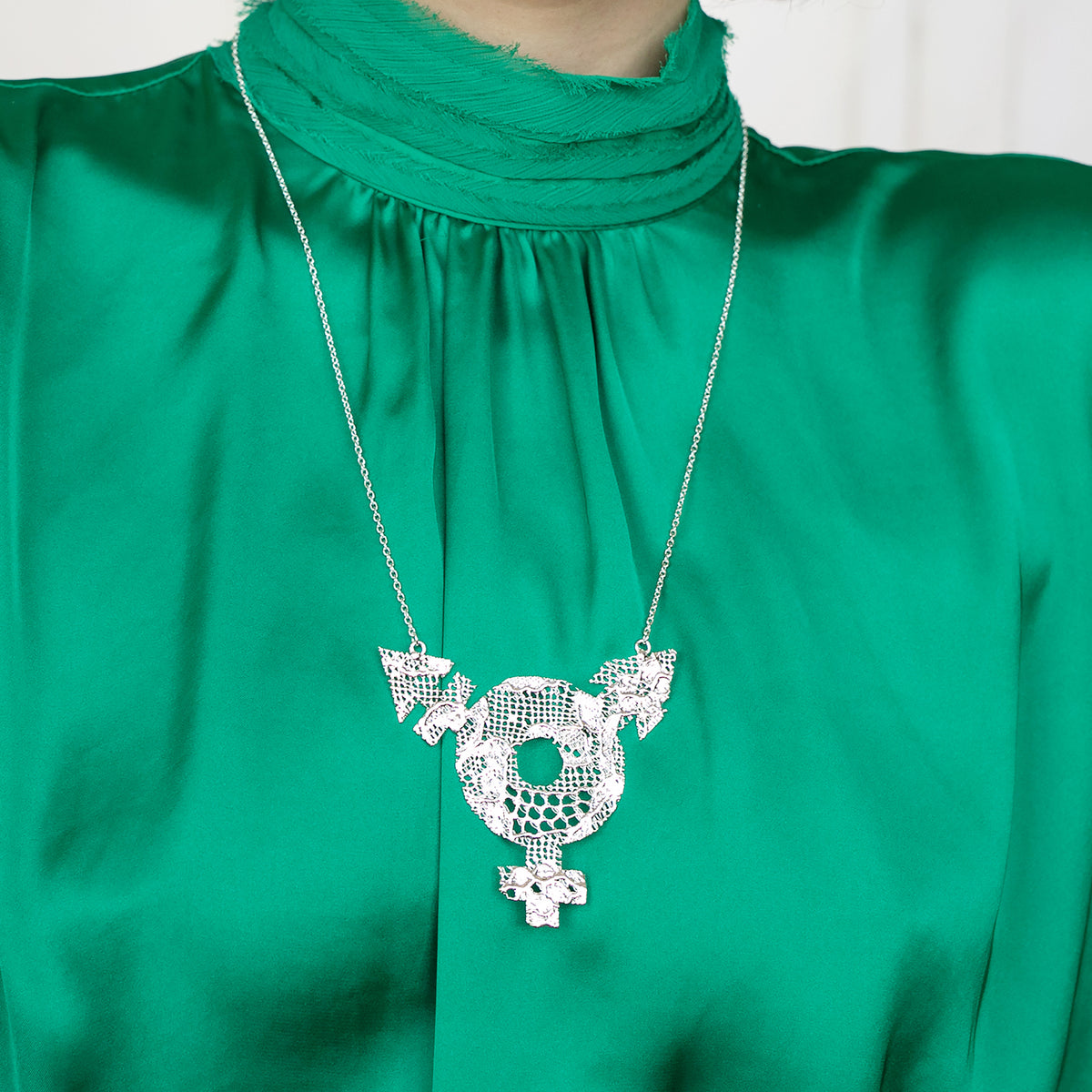 Model Showing Inclusive Lace Necklace with Female, Male and Non-Binary Symbols. Chantilly Lace dipped in Sterling Silver.