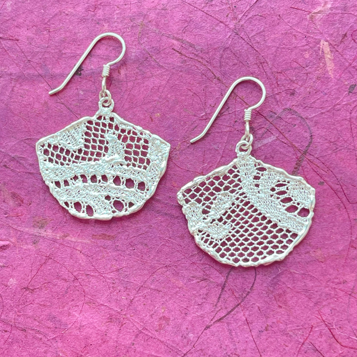 Fan shaped lace earrings in sterling silver.