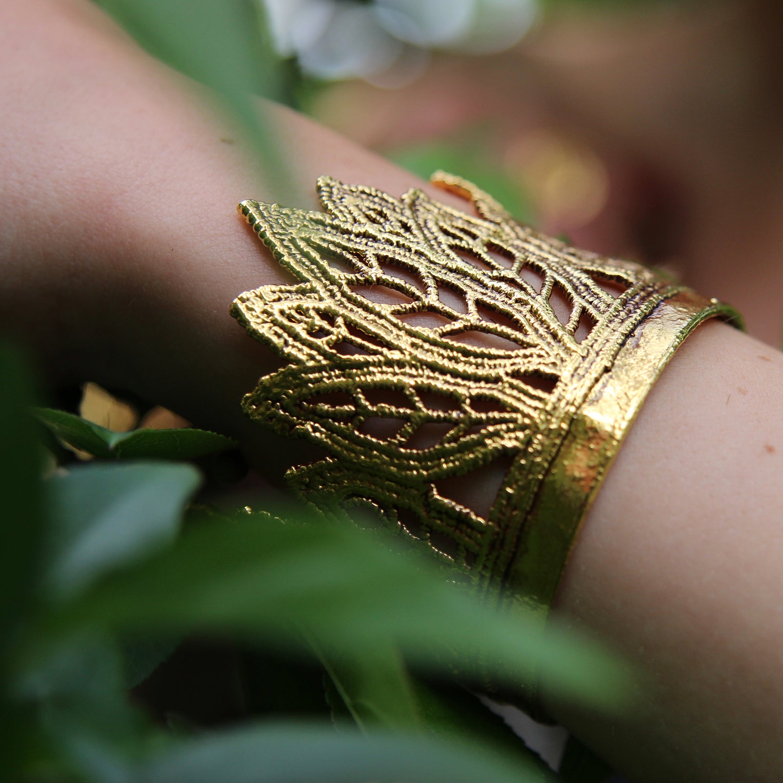 Lace cuff bracelet in the shape of leaves dipped in 24k gold.