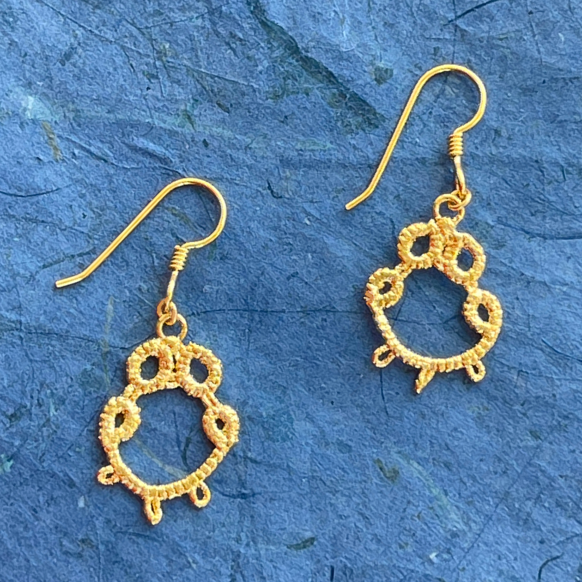 Irish tatted lace earrings in 24k gold on French hooks.