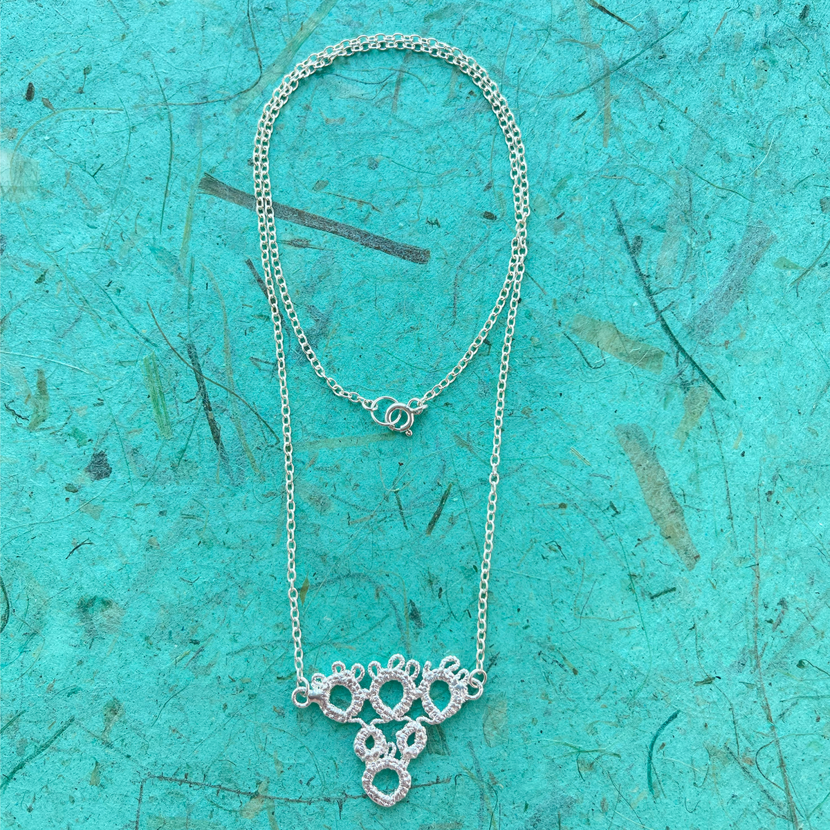 Irish tatted lace pendant necklace in sterling silver.
