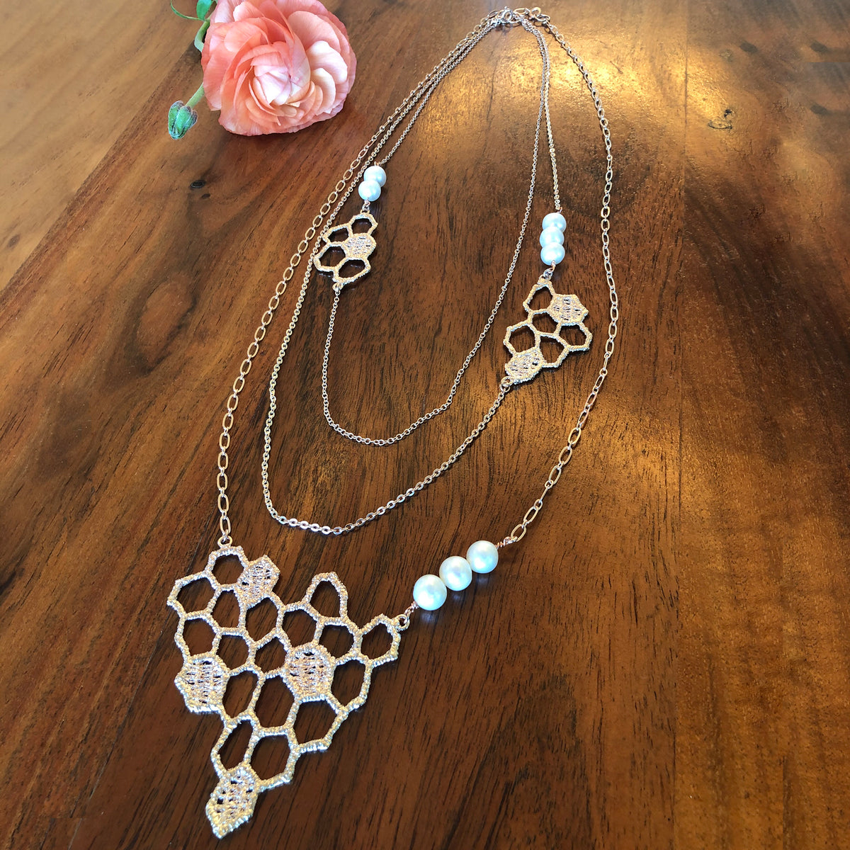 Honeycomb lace pendant necklace in rose cold with white fresh water pearls.