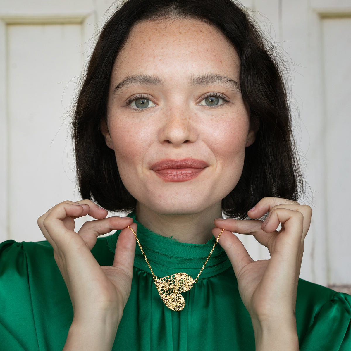 Model with Lace Heart Necklace. Unique 13th anniversary gift. Made from European Chantilly lace dipped in 24k gold.