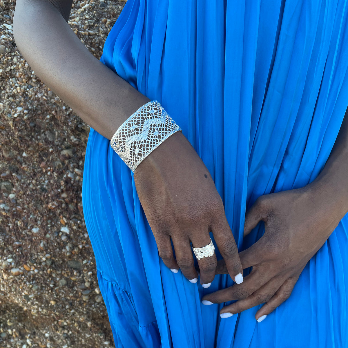 Model wearing lace cuff bracelet made from Art Deco lace dipped in sterling silver.