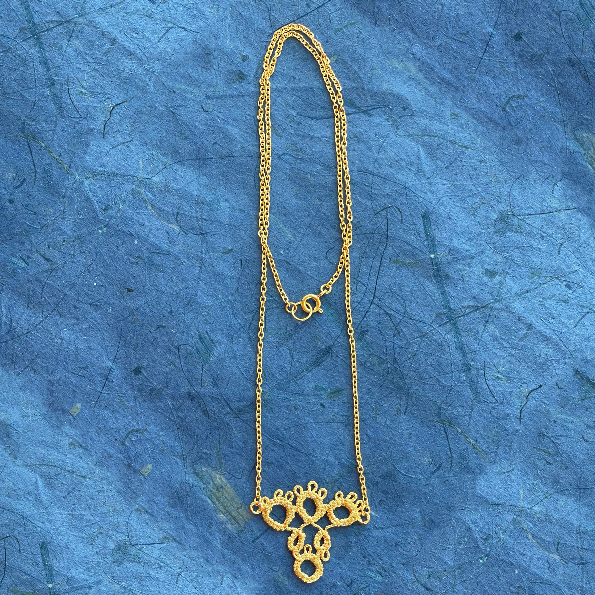 Irish tatted lace pendant necklace in 24k gold.