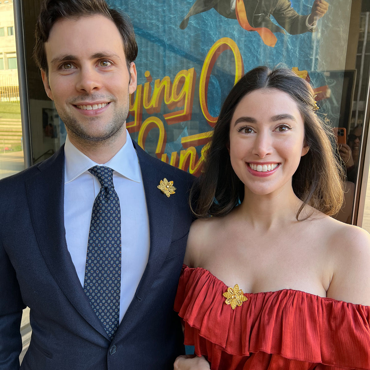 Models wearing Lapel pin and brooch 24k gold lace flower with 10mm white Topaz.