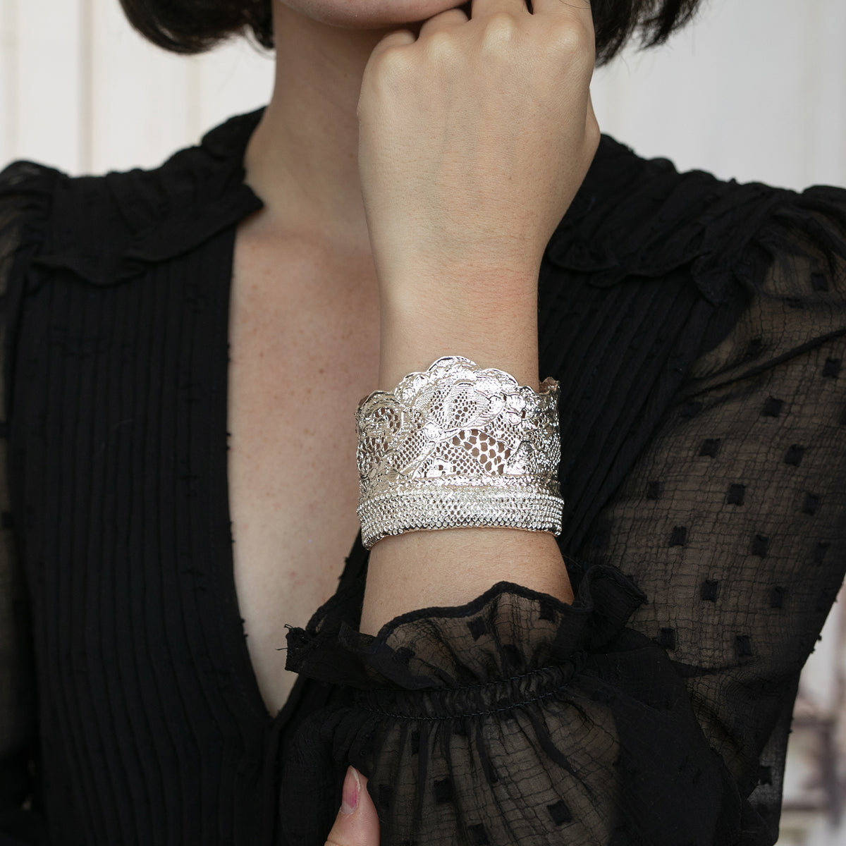 Model Showing Silver lace cuff bracelet, mix of feminine Chantilly lace and masculine mesh. Dipped in sterling silver. 