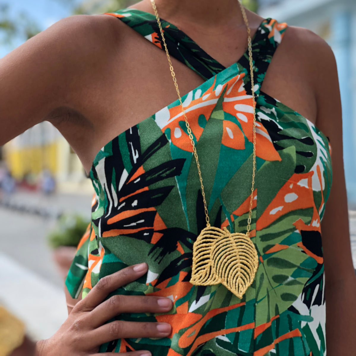 Lace Leaf necklace in dipped 24k gold worn by a model.