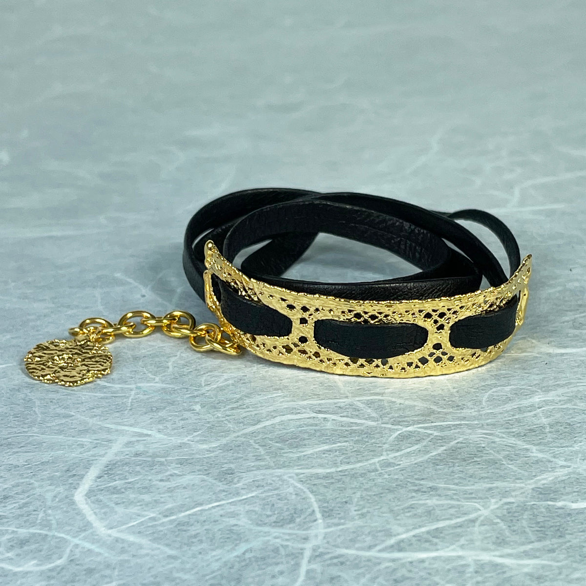 Leather bracelet with vintage lace dipped in 24k gold.