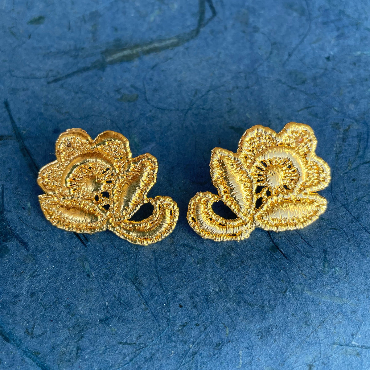 Flower stud earrings made from American lace dipped in 24k gold.