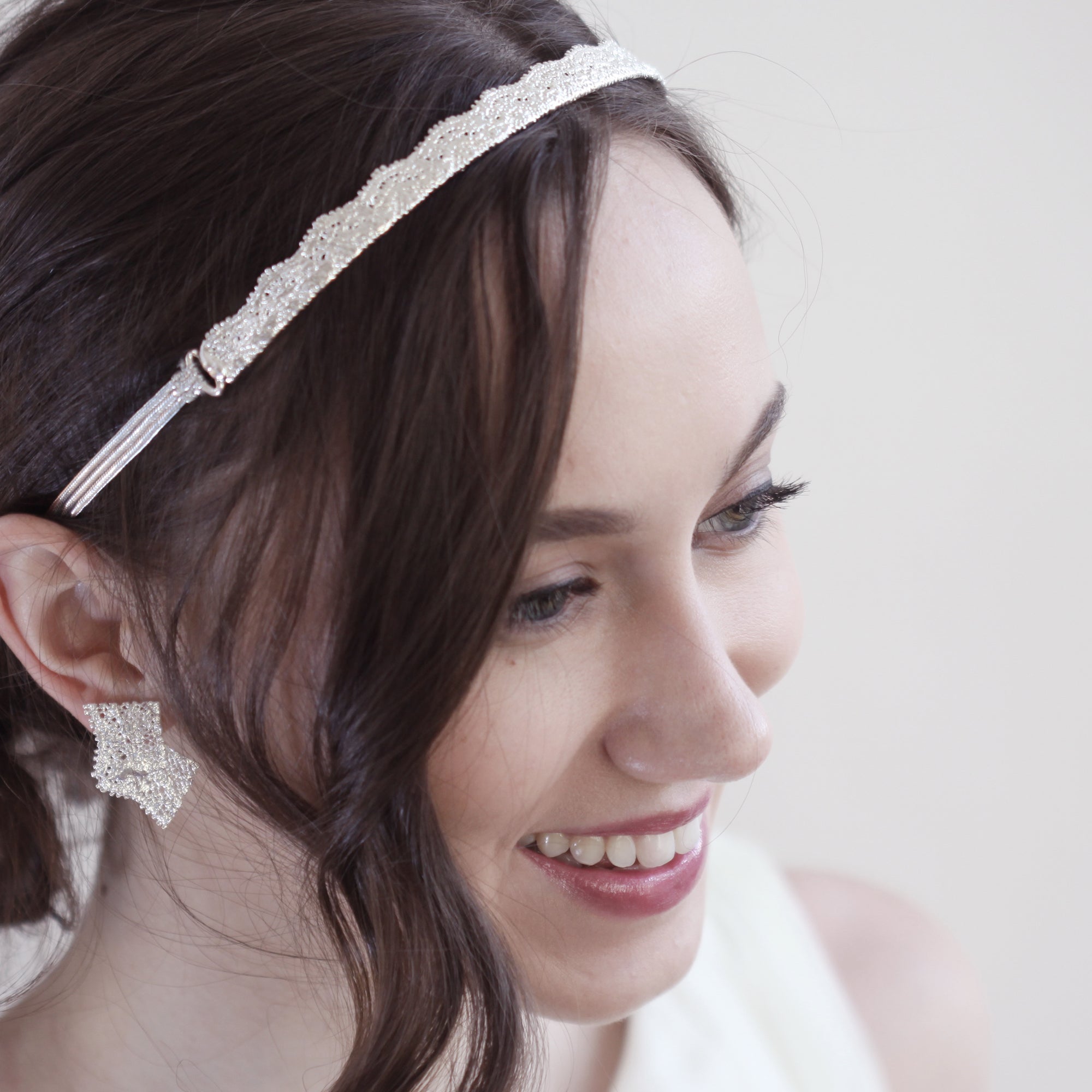 Tiara made from 1920s lace solidified in sterling silver with silk ribbons.