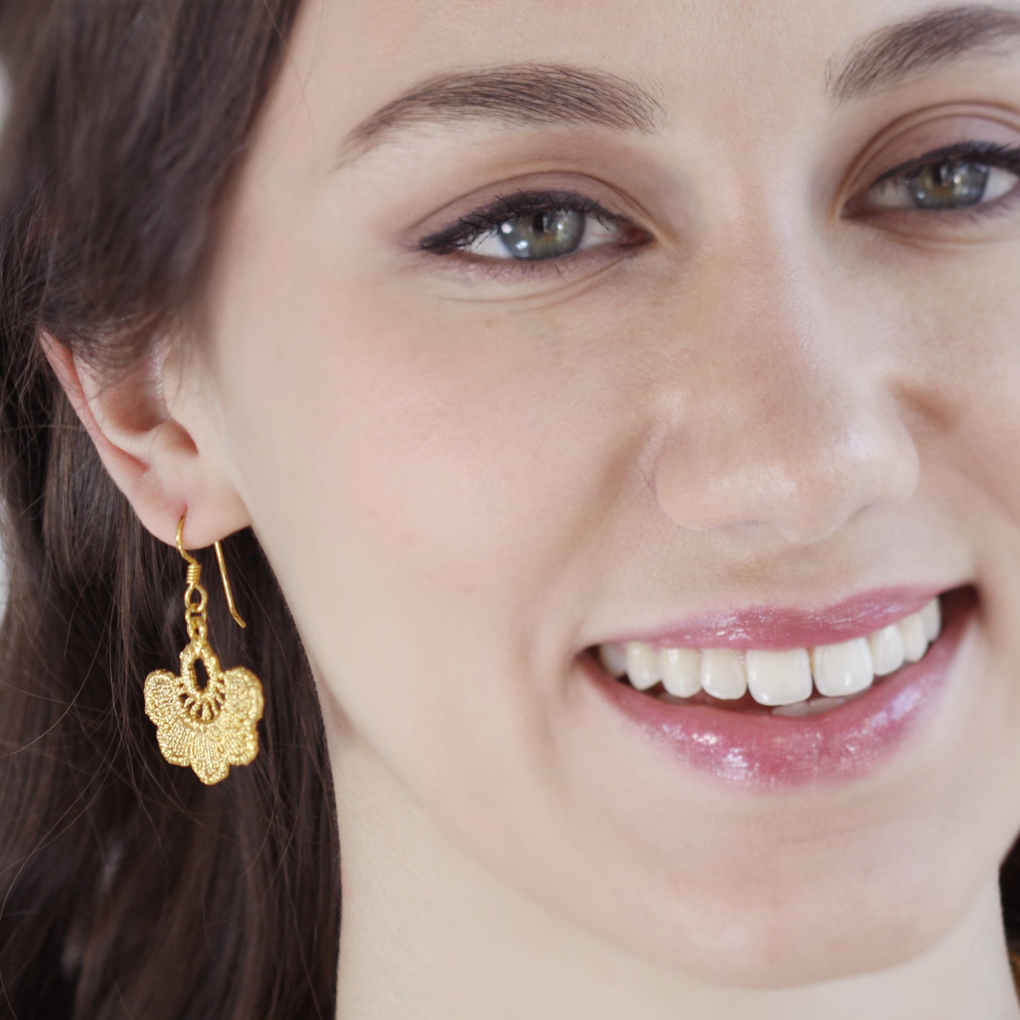 Flower lace earrings on French hooks in 24k gold.