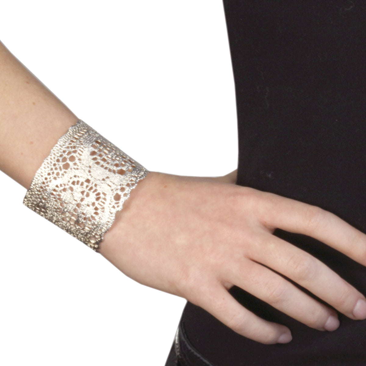 Model wearing cuff bracelet made from 1950s New York Raschel lace dipped in sterling silver.