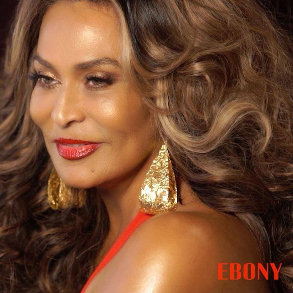 Camille, large lace teardrop earrings in 24k gold worn by a celebrity.