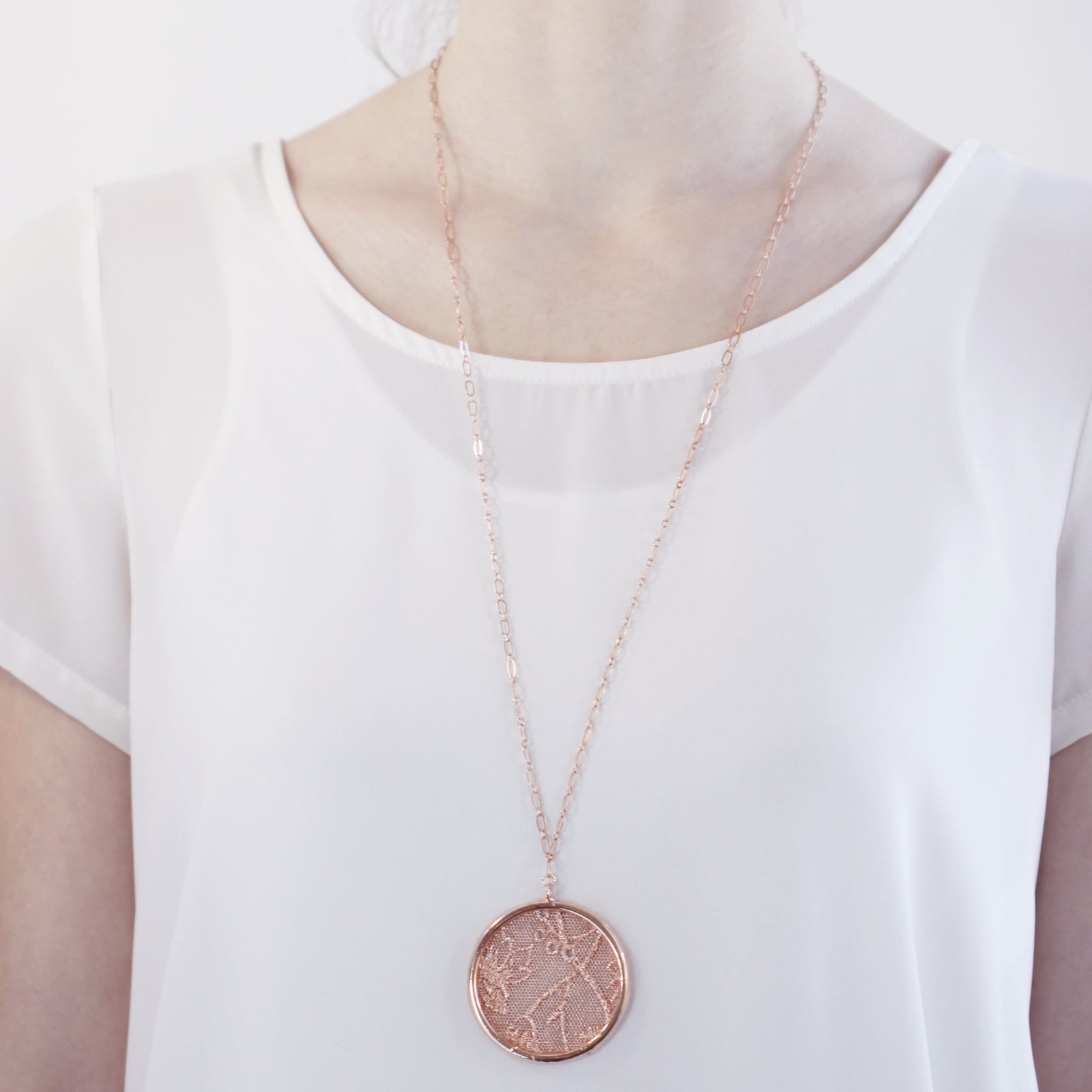Cecilia circular lace pendant necklace in rose gold.