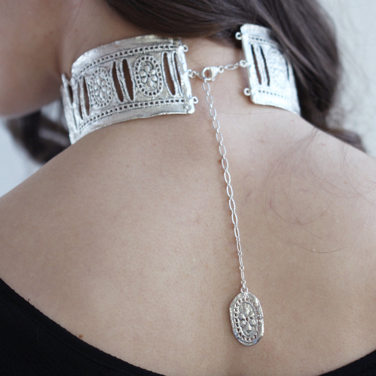 Colette, three-piece hinged lace choker in sterling silver seen from the back.