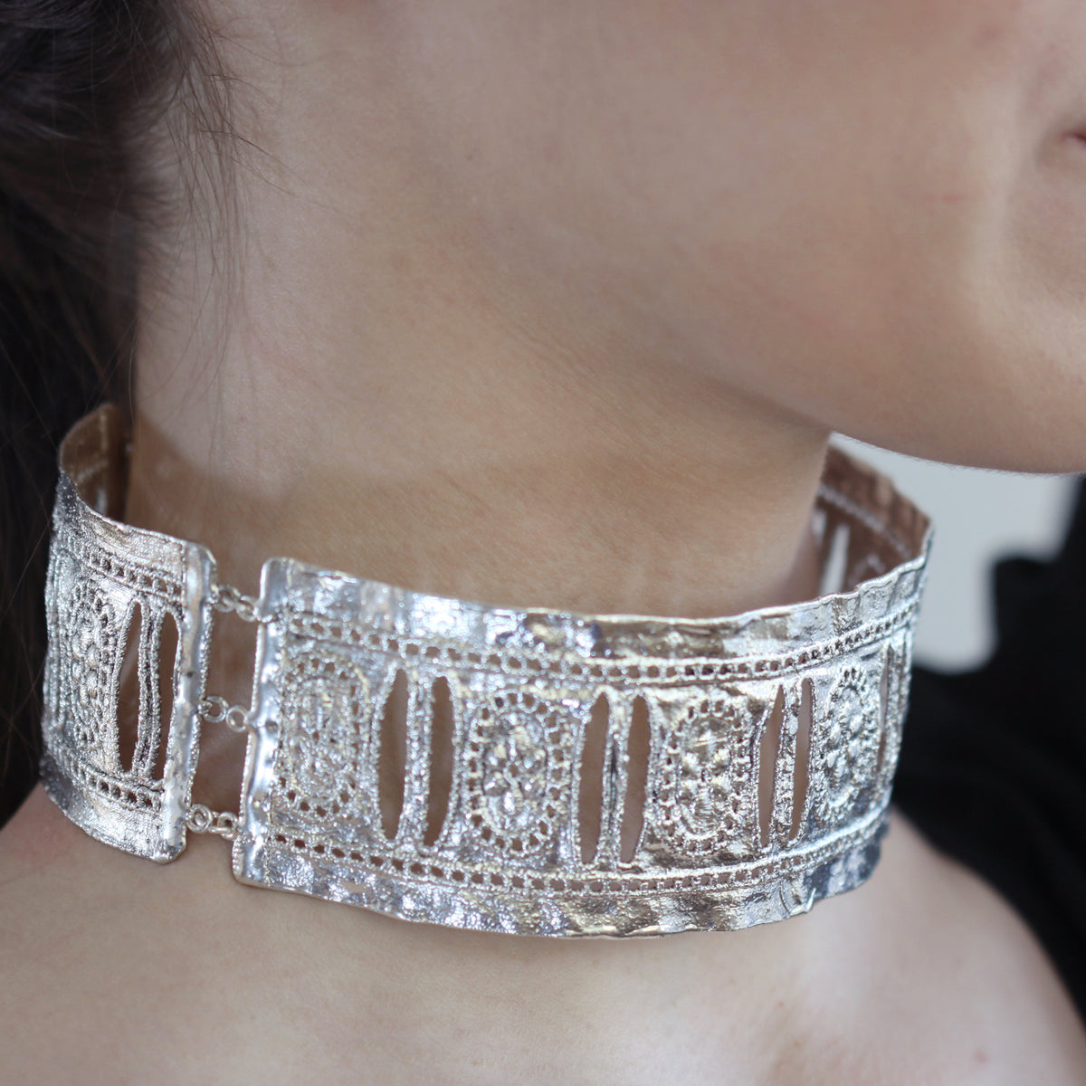 Colette, three-piece hinged lace choker in sterling silver worn by a model.