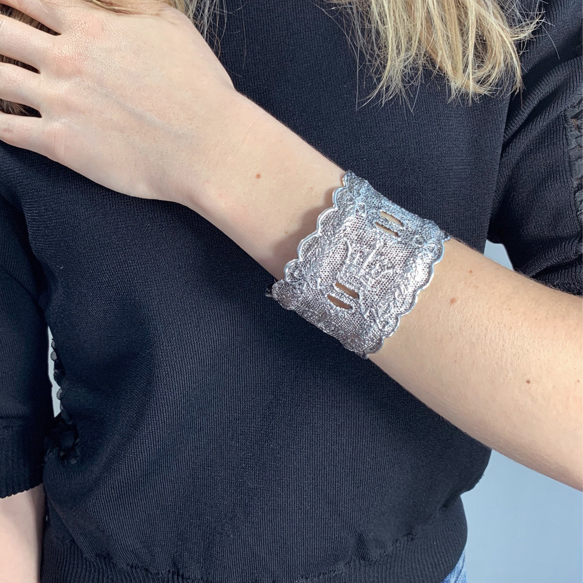 Lace cuff bracelet Elizabeth made with rare royal British lace dipped in sterling silver on model.