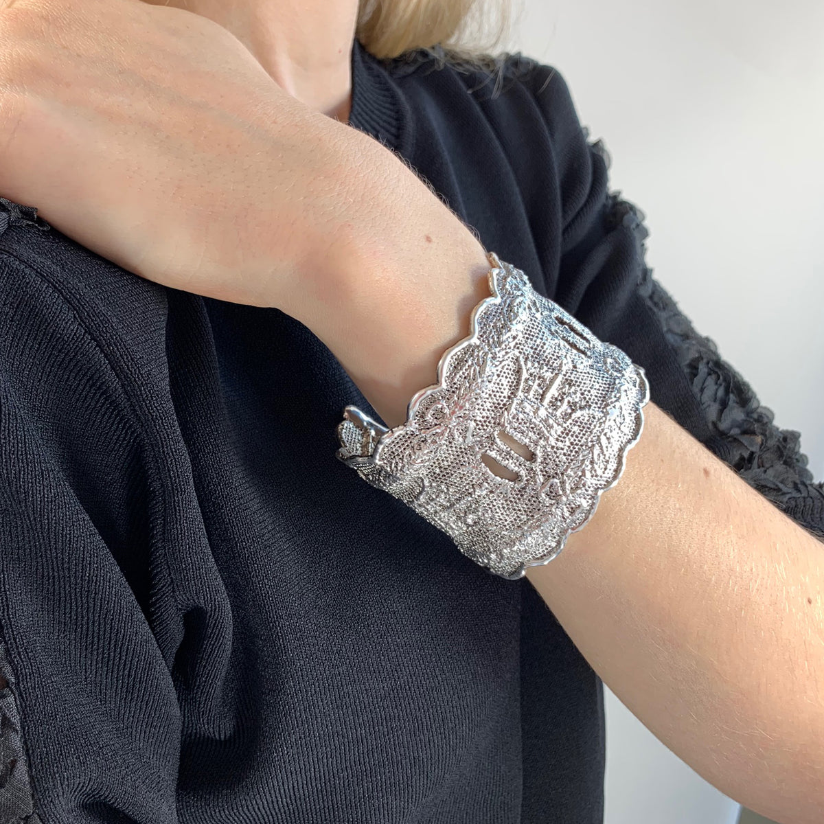 Lace cuff bracelet Elizabeth made with rare royal British lace dipped in sterling silver on model.