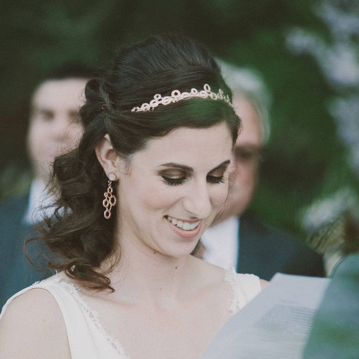 Model showing original lace tiara solidified in rose gold with silk ribbons.