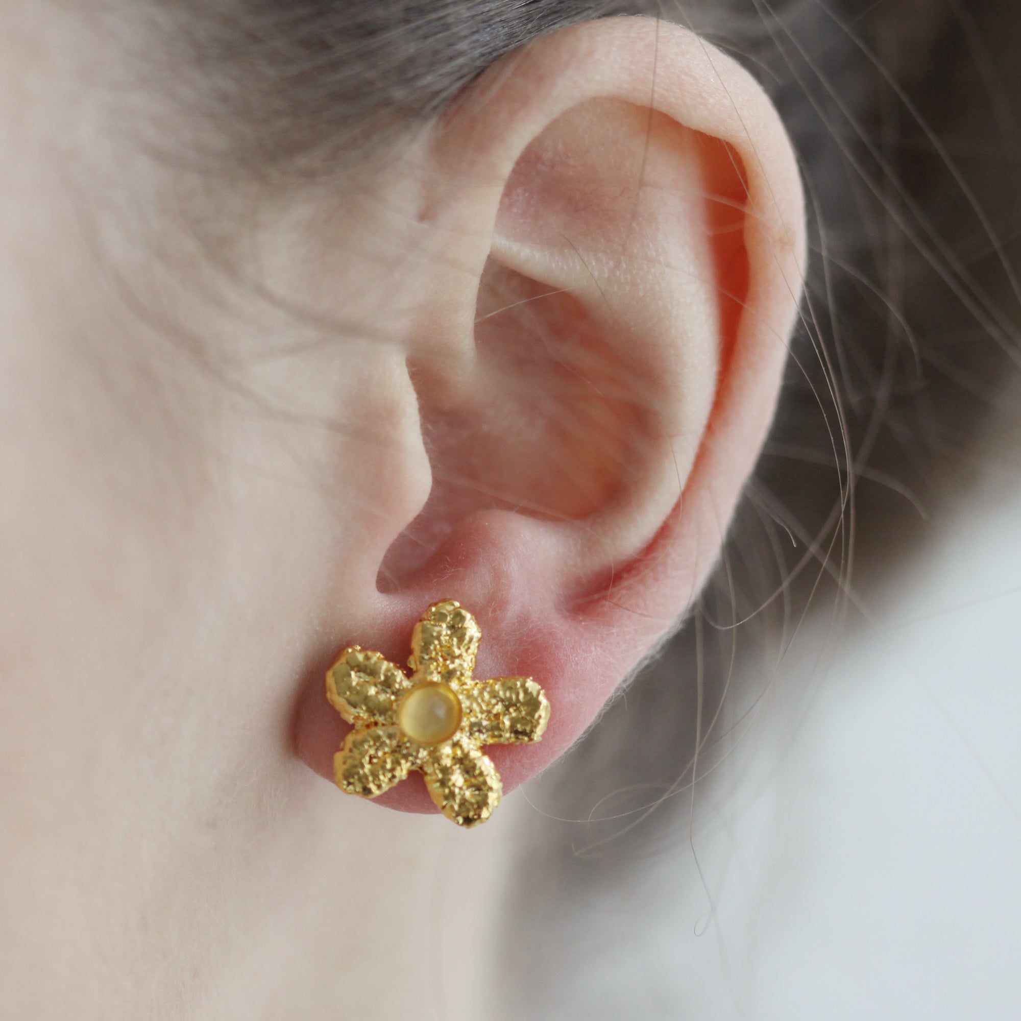 Fae lace stud flower earrings in 24k gold with faceted Moonstones.