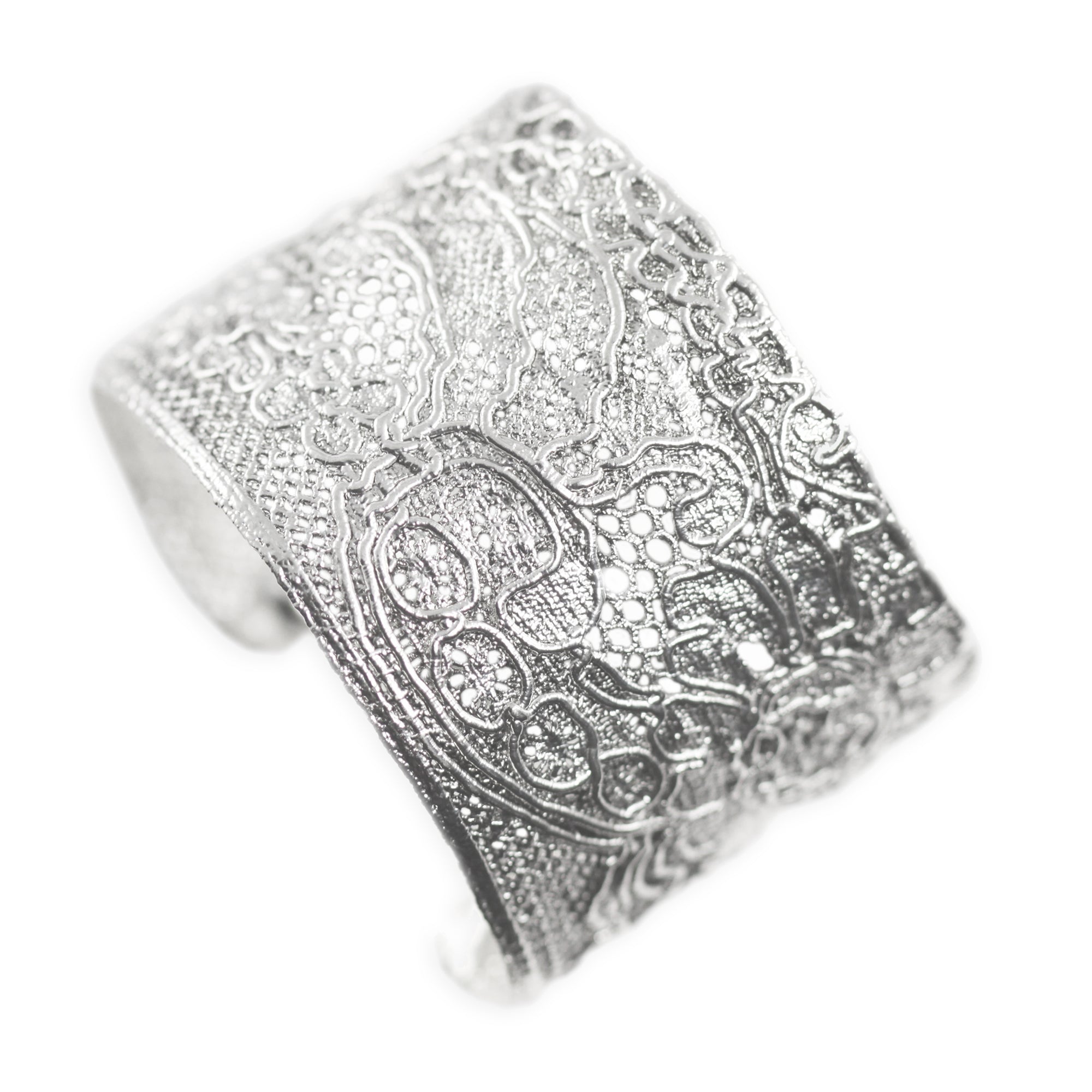 Unique cuff bracelet with an intricate design made from 1920s French lace solidified in sterling silver.