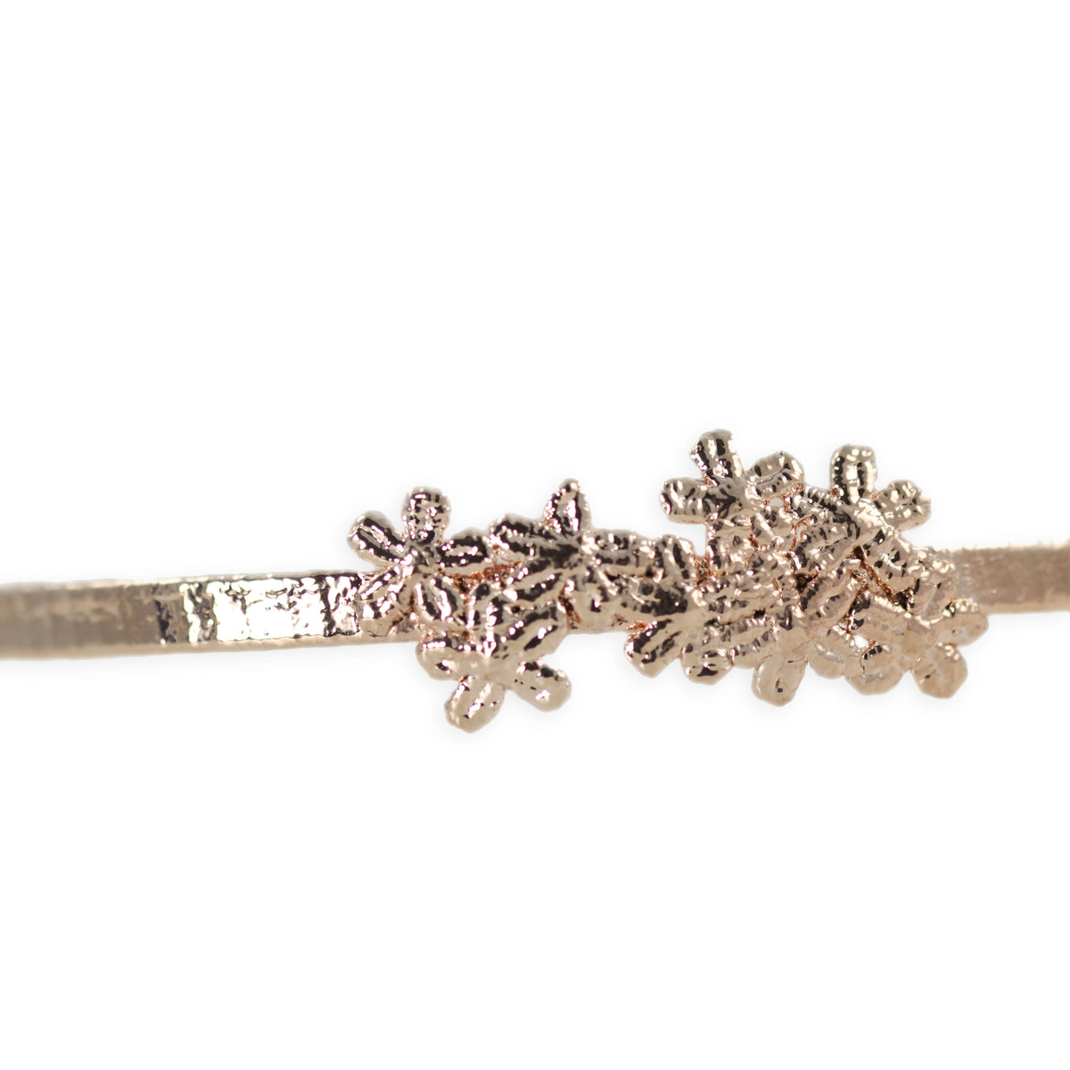 Flower lace hairband in rose gold.