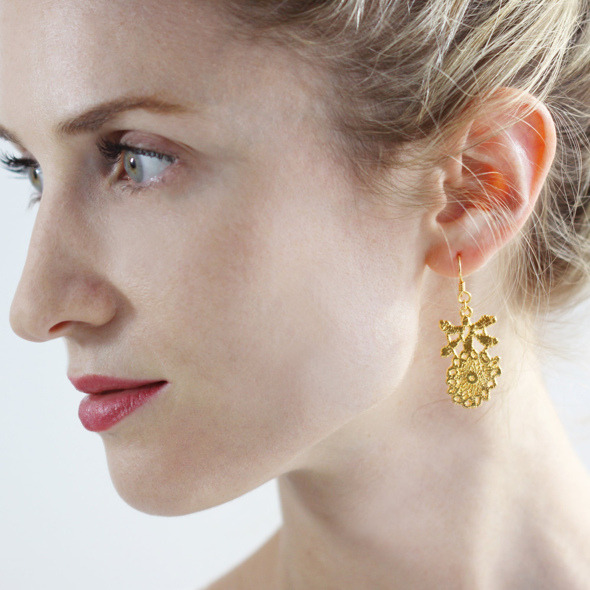 Lace flower earrings with French hooks dipped in 24k gold.