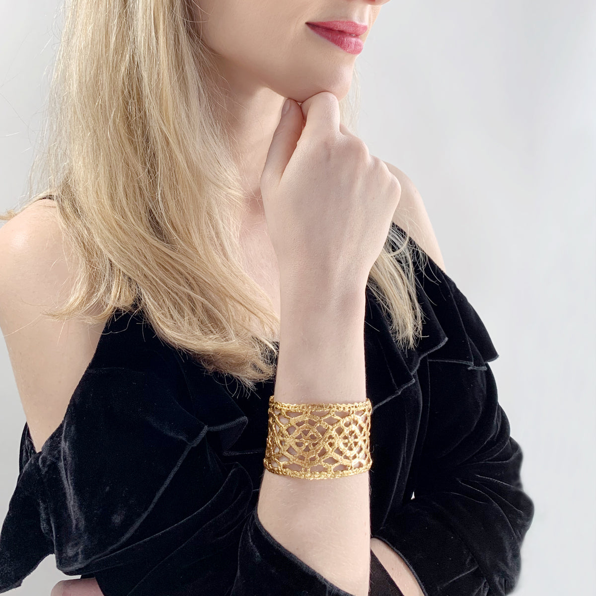Model wearing Classic Cuff bracelet made from Antique lace dipped in 24k gold.