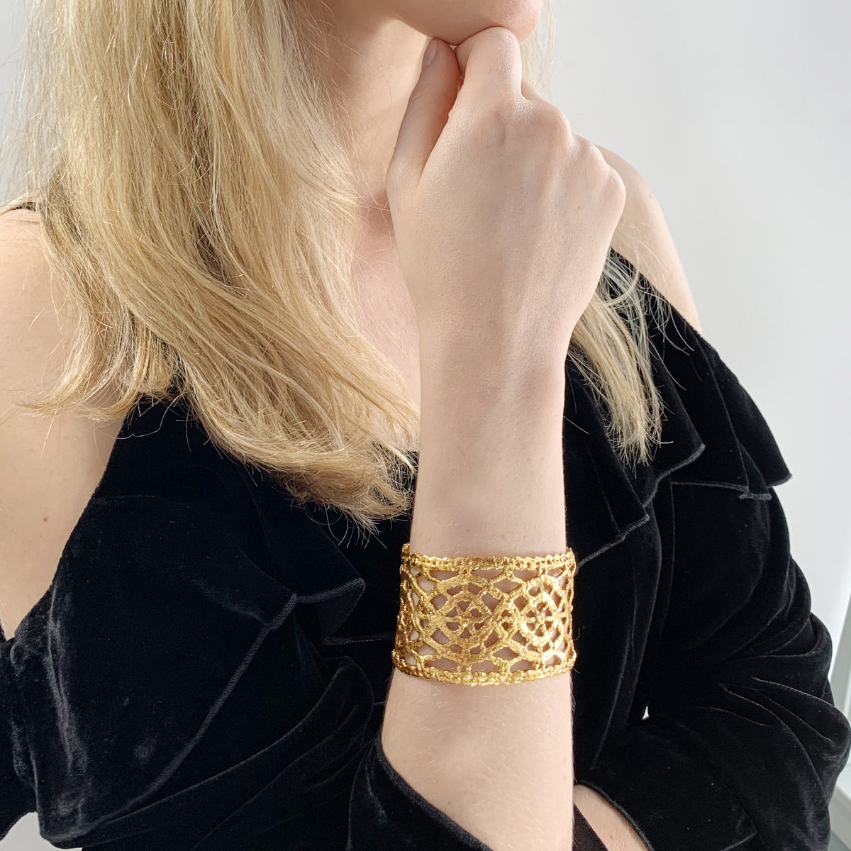 Model wearing Classic Cuff bracelet made from Antique lace dipped in 24k gold.