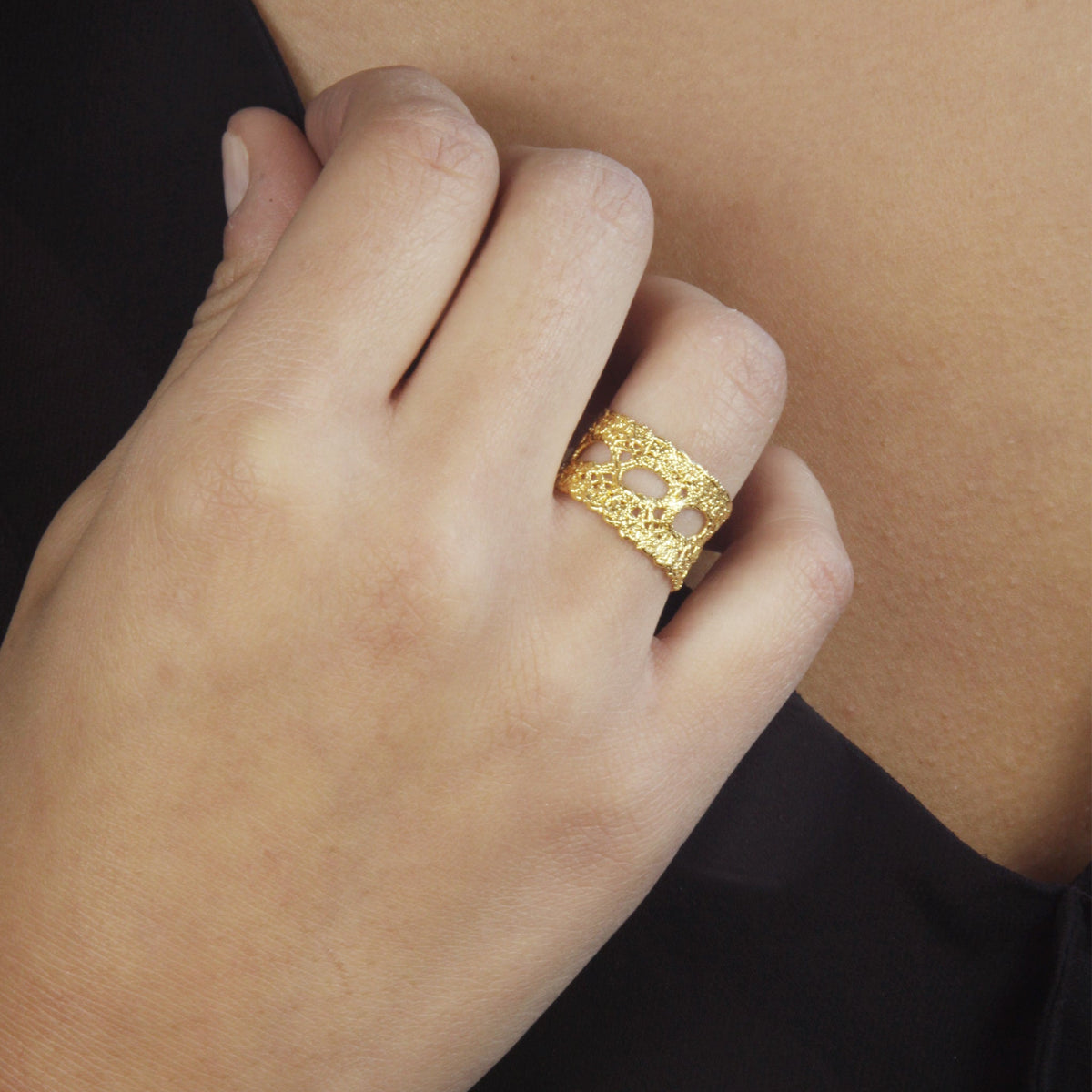 Model wearing Isabelle lace ring dipped in 24k gold.
