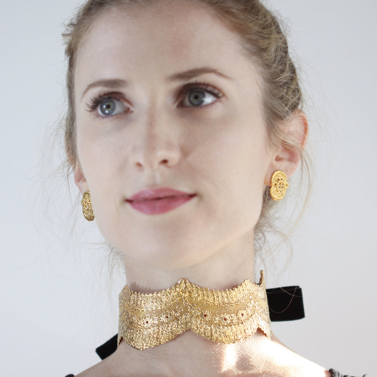 Rare lace choker in 24k gold with velvet tie worn by model.