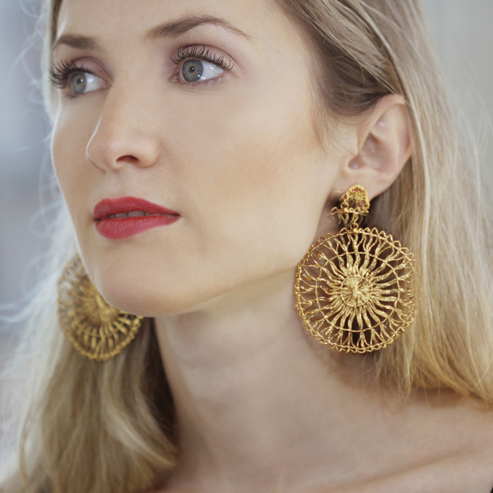 Circular lace pendant earrings made from Tenerife lace. Solidified in 24k gold.