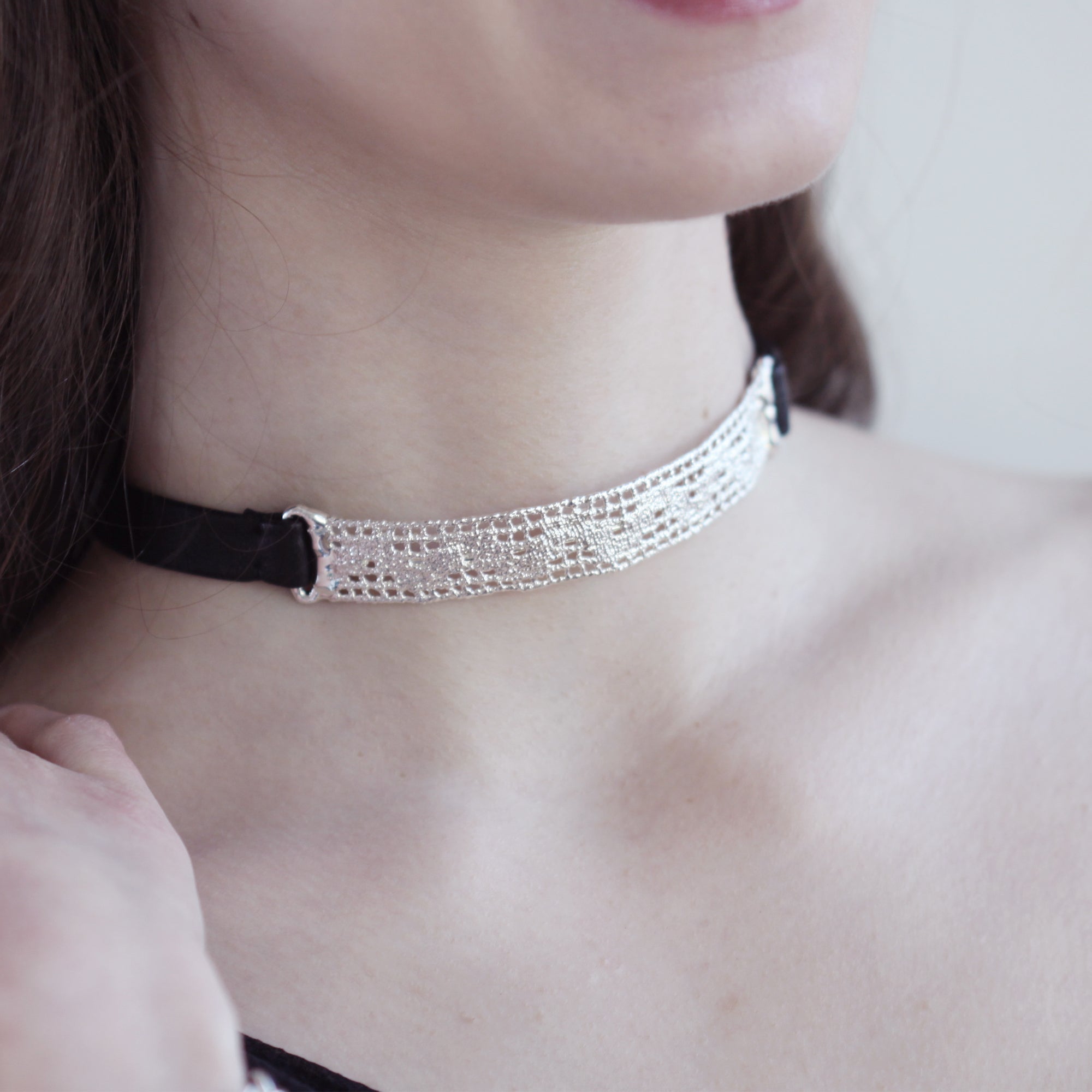 Leather and lace choker necklace in sterling silver.