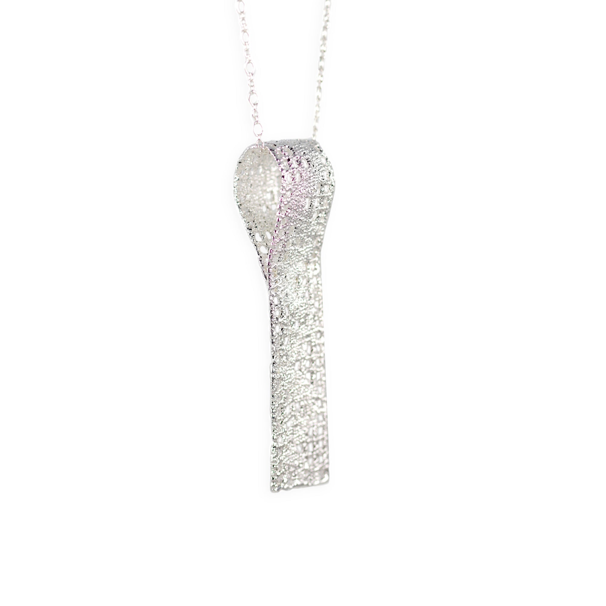 Lace pendant necklace solidified in sterling silver.